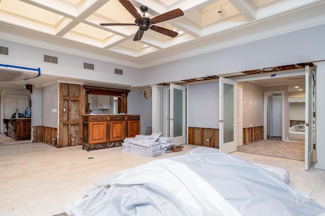 bedroom featuring ceiling fan, beam ceiling, crown molding, and coffered ceiling