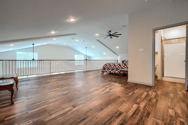 interior space featuring lofted ceiling and dark hardwood / wood-style flooring