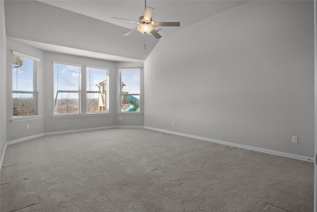 spare room with lofted ceiling, light carpet, and ceiling fan