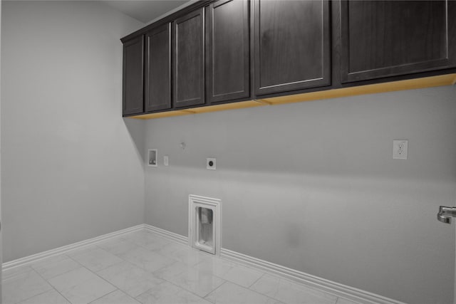 washroom featuring cabinets, gas dryer hookup, washer hookup, and hookup for an electric dryer