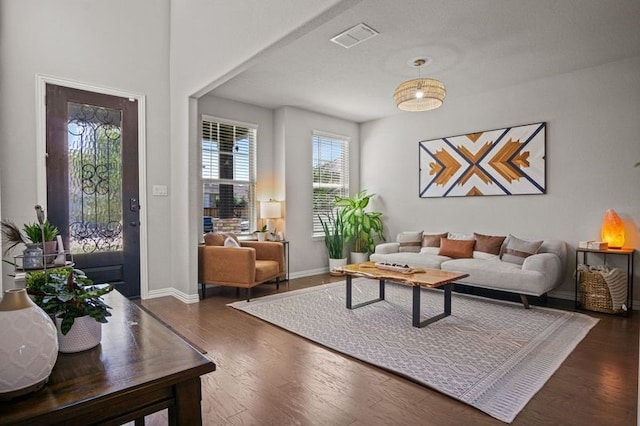 living room with dark hardwood / wood-style flooring