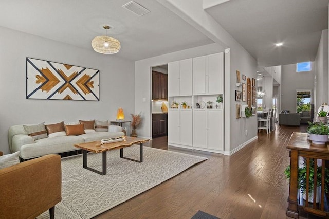 living room featuring dark wood-type flooring