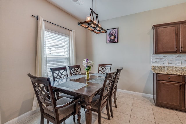 dining area featuring light tile patterned floors