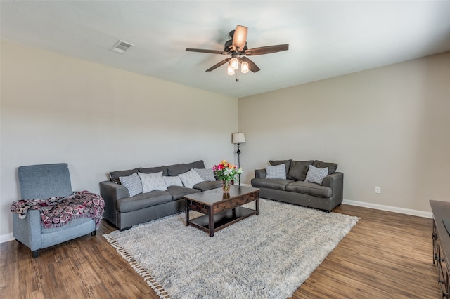 living room featuring ceiling fan and wood-type flooring