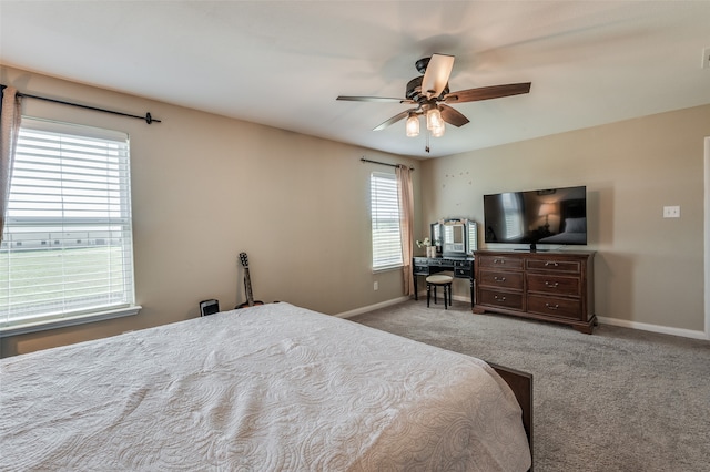 bedroom featuring ceiling fan and light carpet