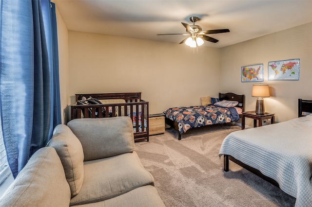 bedroom with ceiling fan and carpet floors