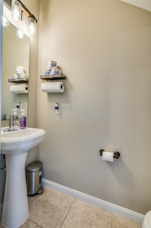 bathroom with tile patterned flooring