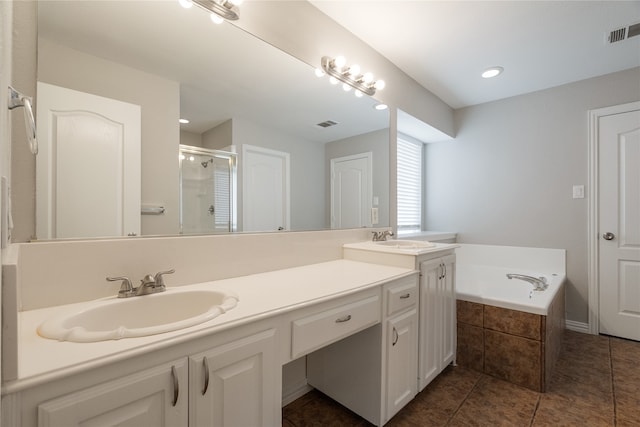 bathroom featuring vanity, independent shower and bath, and tile patterned flooring