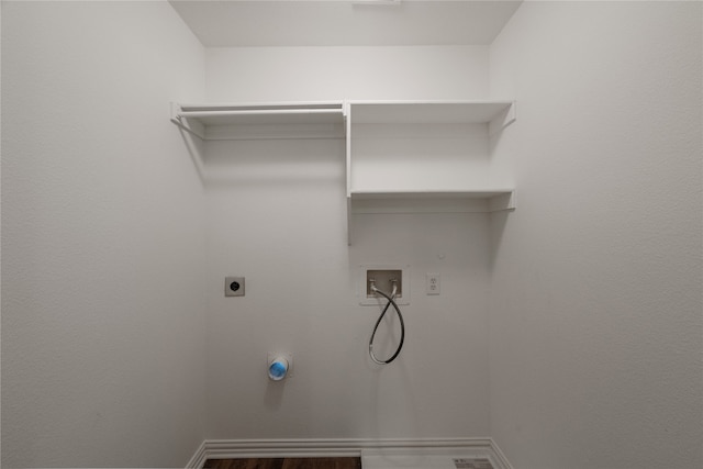 laundry room featuring hardwood / wood-style flooring, electric dryer hookup, and washer hookup