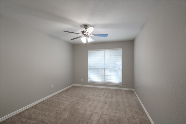 unfurnished room featuring light carpet and ceiling fan