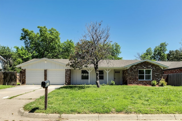 ranch-style house with a front yard and a garage