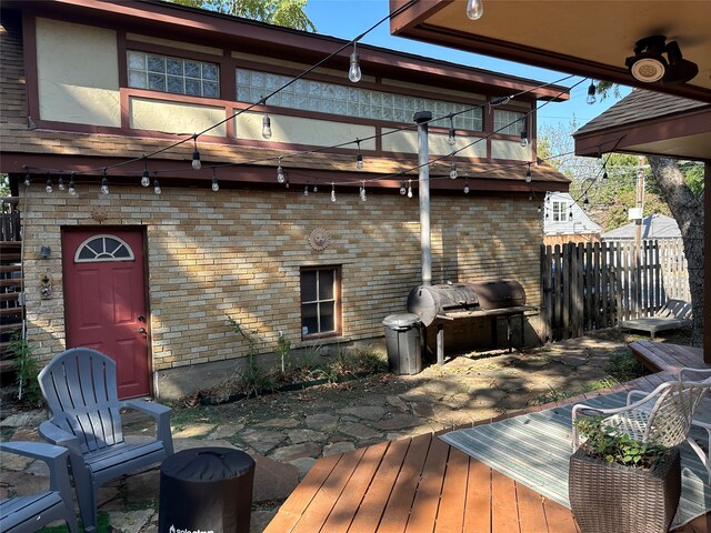 deck with a patio and a grill