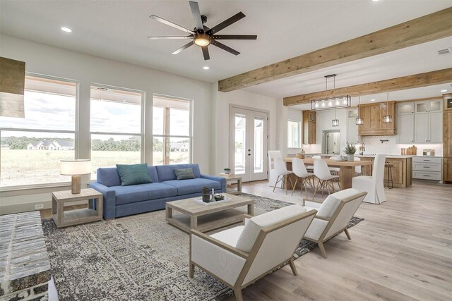 unfurnished living room featuring light hardwood / wood-style floors, ceiling fan, and a brick fireplace