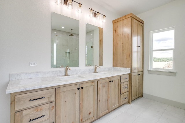 bathroom with tile patterned flooring, vanity, and a shower with shower door