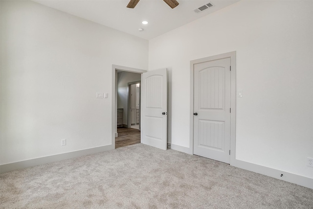 unfurnished bedroom with ceiling fan and carpet floors