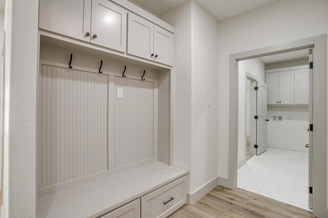 bathroom with walk in shower, vanity, tile patterned flooring, and toilet