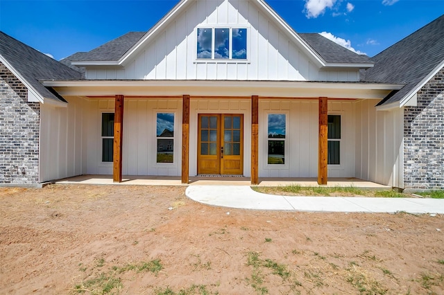 back of property with covered porch