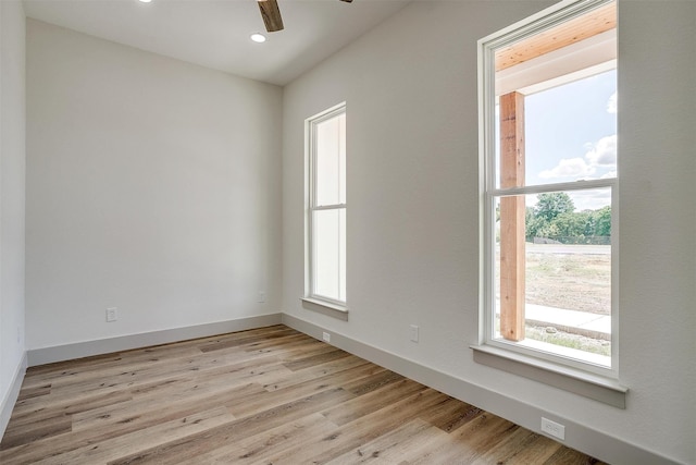 spare room with ceiling fan and light hardwood / wood-style flooring