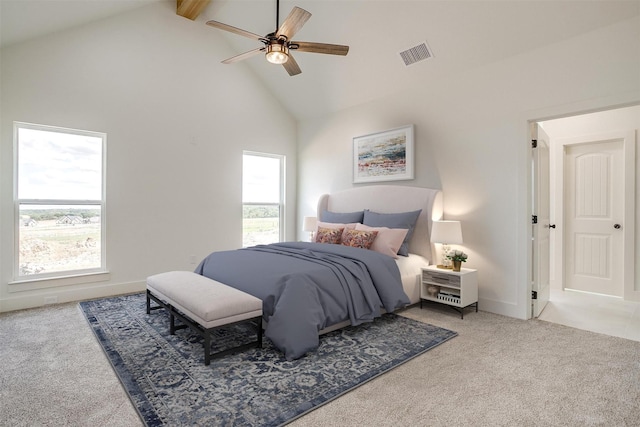 carpeted bedroom featuring high vaulted ceiling, ceiling fan, visible vents, and beam ceiling