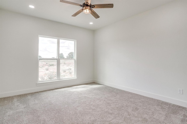 empty room featuring recessed lighting, carpet flooring, a ceiling fan, and baseboards