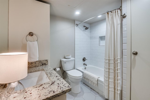 full bathroom with shower / bathtub combination with curtain, vanity, tile patterned flooring, and toilet