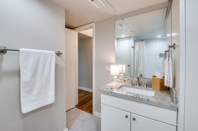 bathroom with vanity, tile patterned flooring, and a shower with shower curtain