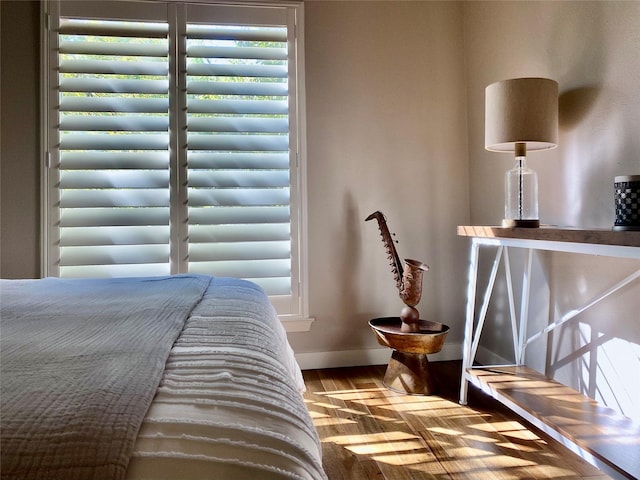 bedroom with hardwood / wood-style floors