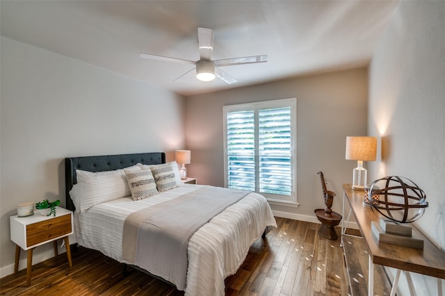 bedroom featuring dark wood-type flooring and ceiling fan