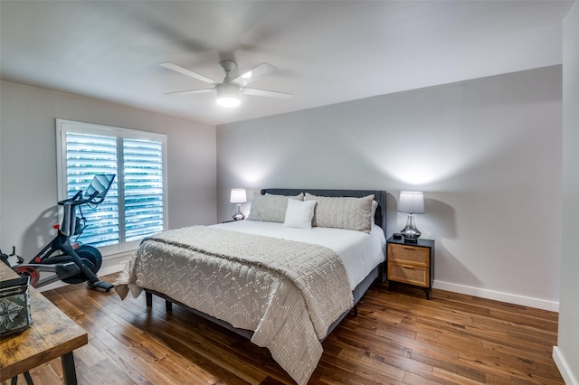 bedroom featuring dark hardwood / wood-style flooring and ceiling fan