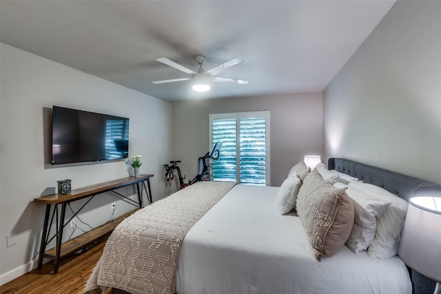 bedroom featuring wood-type flooring and ceiling fan