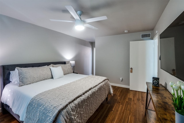 bedroom with ceiling fan and dark hardwood / wood-style flooring