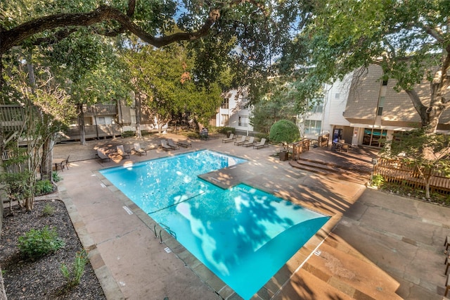 view of swimming pool with a patio