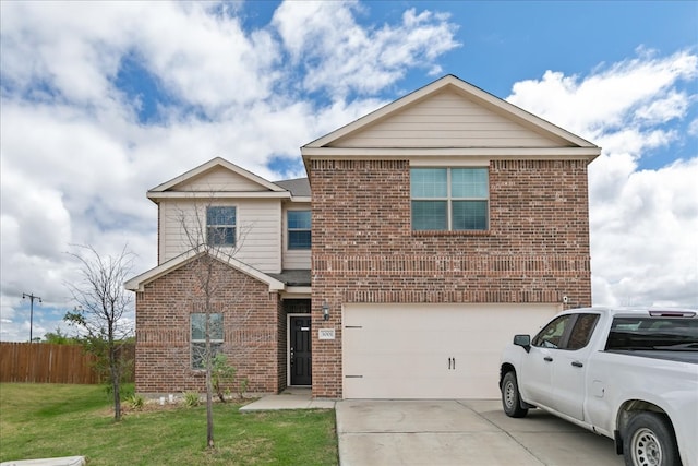 view of front property with a garage and a front lawn