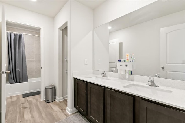 bathroom featuring shower / tub combo, vanity, and wood-type flooring