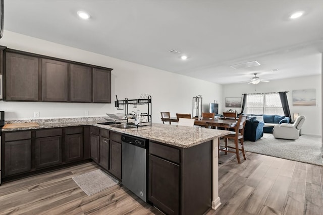 kitchen with ceiling fan, dark brown cabinets, hardwood / wood-style floors, and stainless steel dishwasher