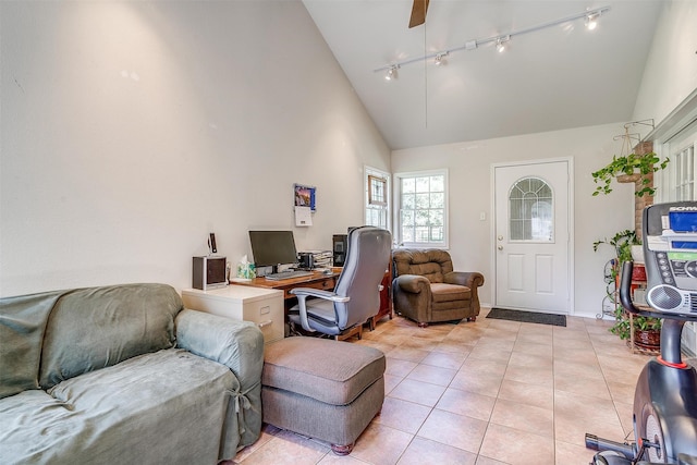 interior space featuring high vaulted ceiling, rail lighting, and ceiling fan