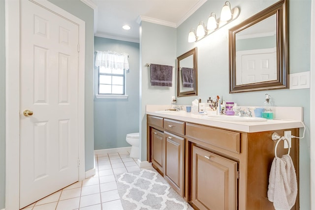 bathroom with crown molding, vanity, toilet, and tile patterned floors