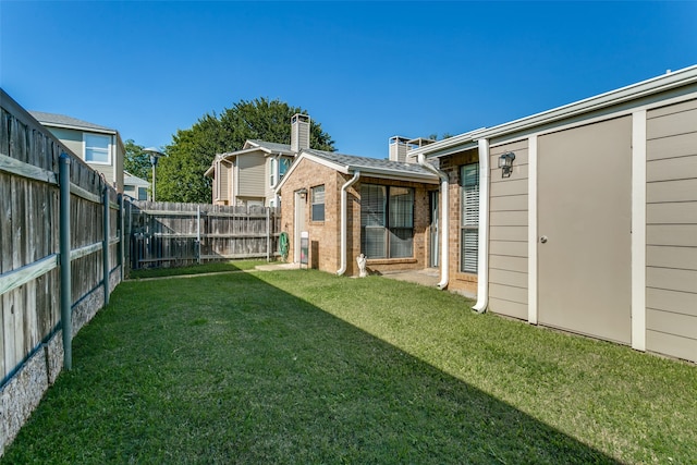 view of yard with a storage shed