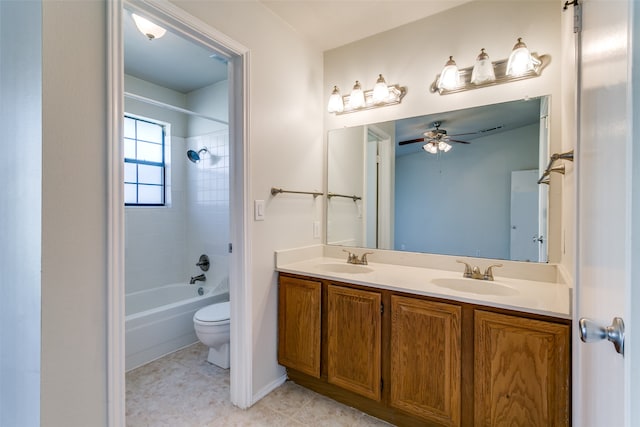 full bathroom with tile patterned floors, toilet, tiled shower / bath combo, ceiling fan, and vanity