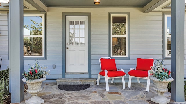 doorway to property featuring a porch