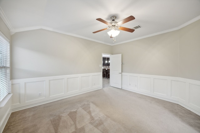 unfurnished room with crown molding, ceiling fan, light colored carpet, and lofted ceiling