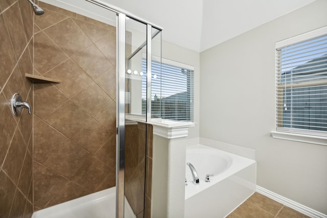 bathroom featuring tile patterned floors and plus walk in shower