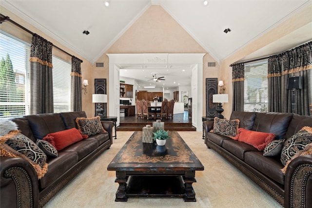 living room with light carpet, ornamental molding, and lofted ceiling