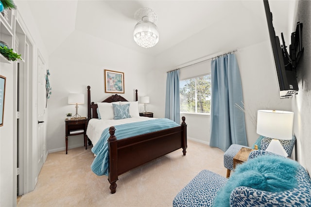 carpeted bedroom with vaulted ceiling