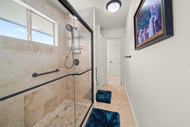 bathroom with tile patterned flooring and a shower with shower door