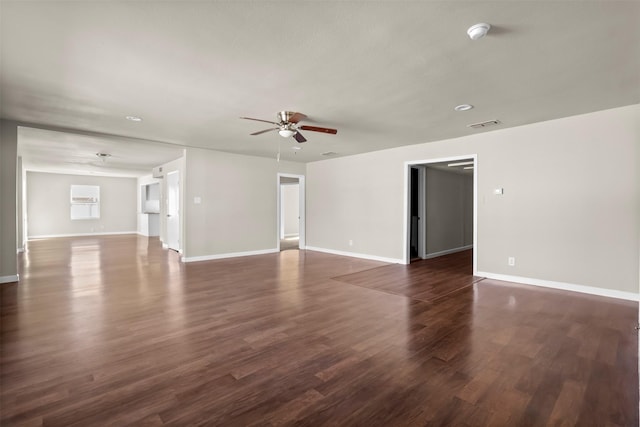 spare room featuring dark hardwood / wood-style floors and ceiling fan