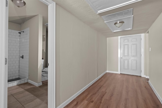 hall with light hardwood / wood-style flooring