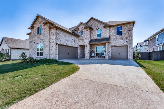 view of front of home with a garage and a front yard