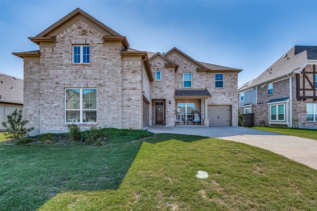 view of front of house featuring a garage and a front yard