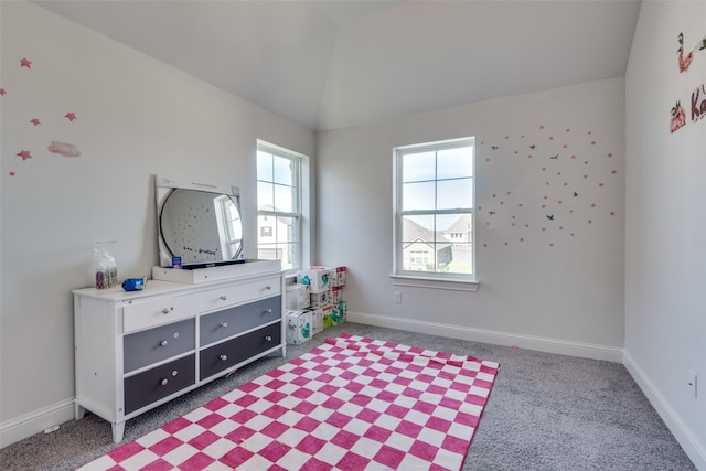 carpeted bedroom featuring lofted ceiling